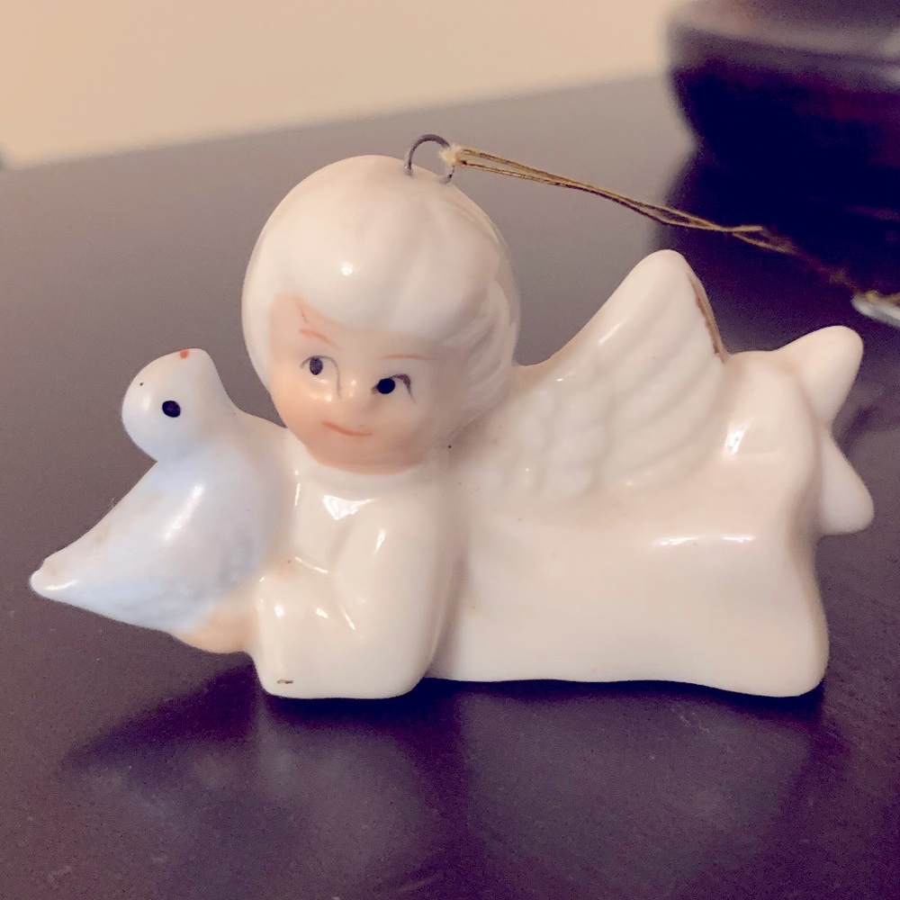 Vintage Christmas Angel with bird porcelain Ornament.